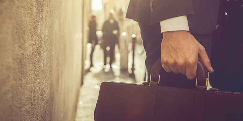 person walking with briefcase