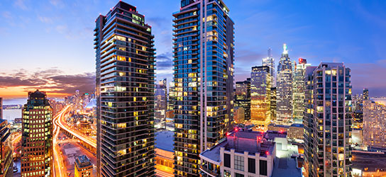 sunset between tall city buildings