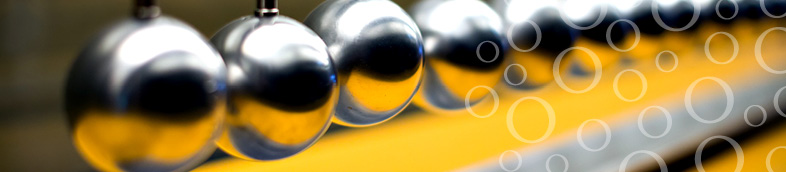 Close-up of metal balls on Newton cradle.