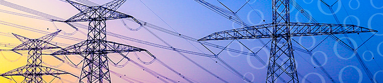 Five transmission towers with gradient sunset in background.
