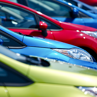 Selective focus of cars at European dealership.