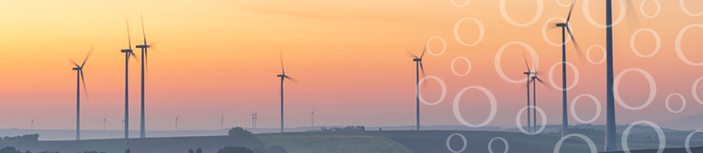 Countryside landscape with wind turbines.
