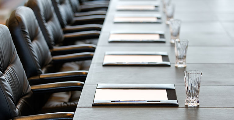 Boardroom with notebooks