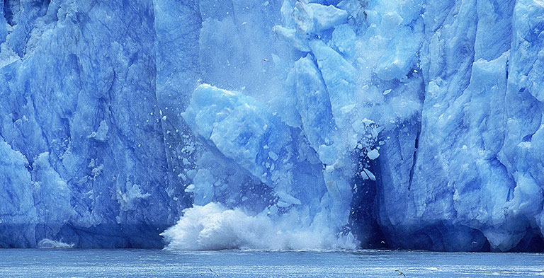 Ice breaking off glacier
