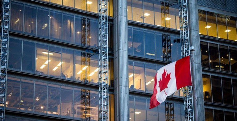 building with canadian flag