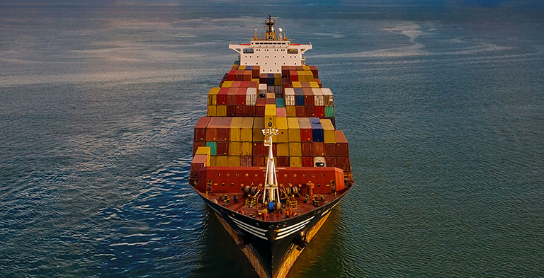Aerial view of Container freight ship in transit