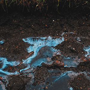 Liquid Chemical Pollutant on Muddy Ground 
