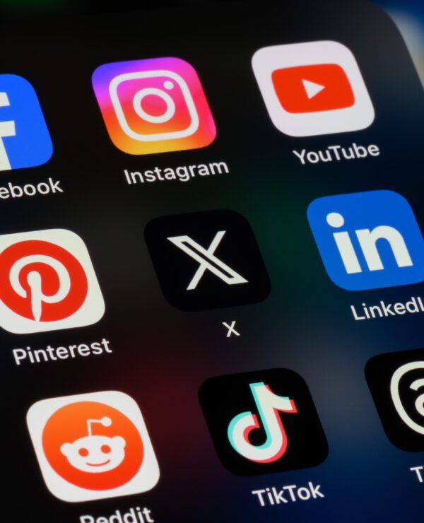 Popular social media apps on a phone screen.